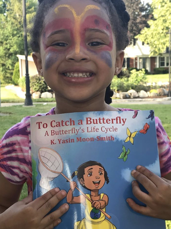 Girl with Butterly face and book